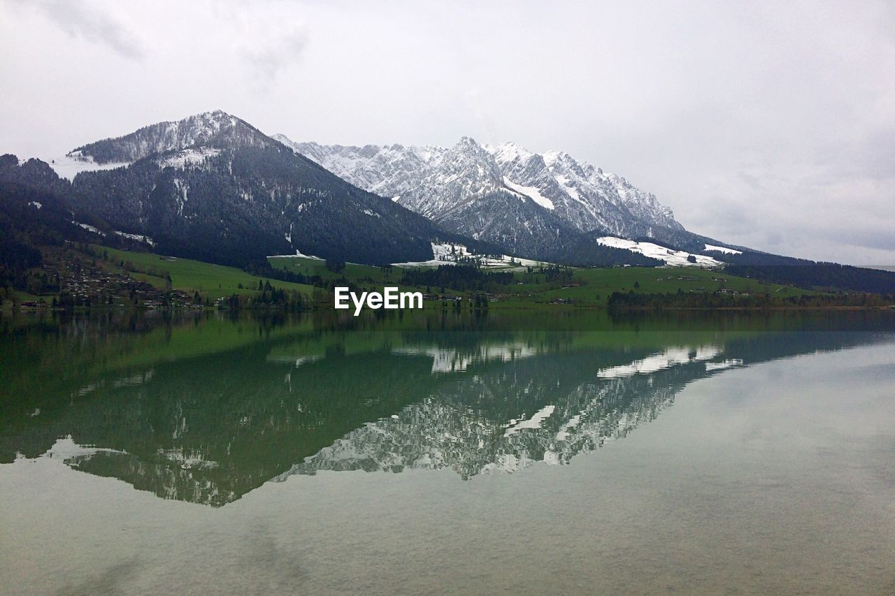 Scenic view of lake with mountains in background