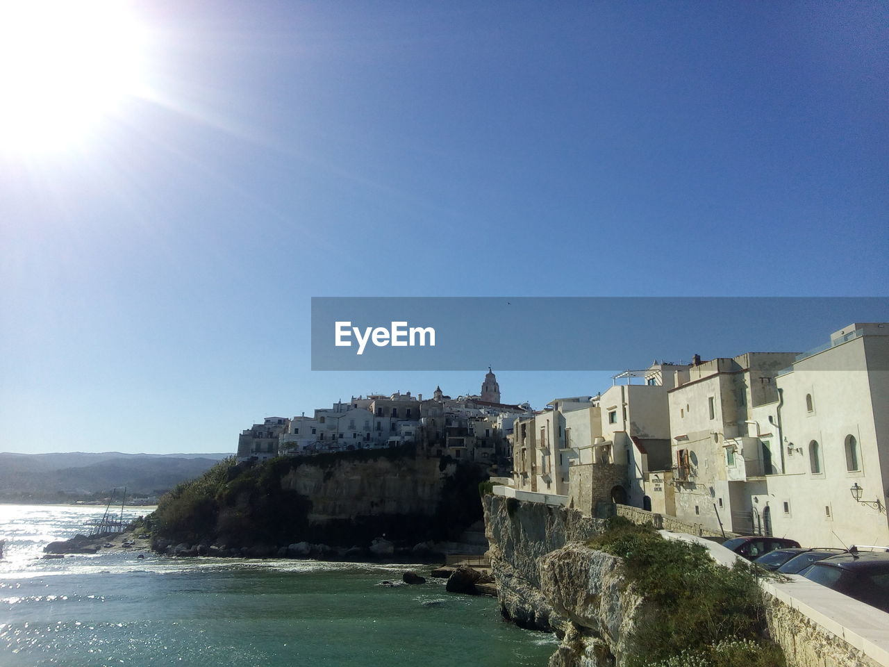 VIEW OF BUILDINGS AGAINST BLUE SKY