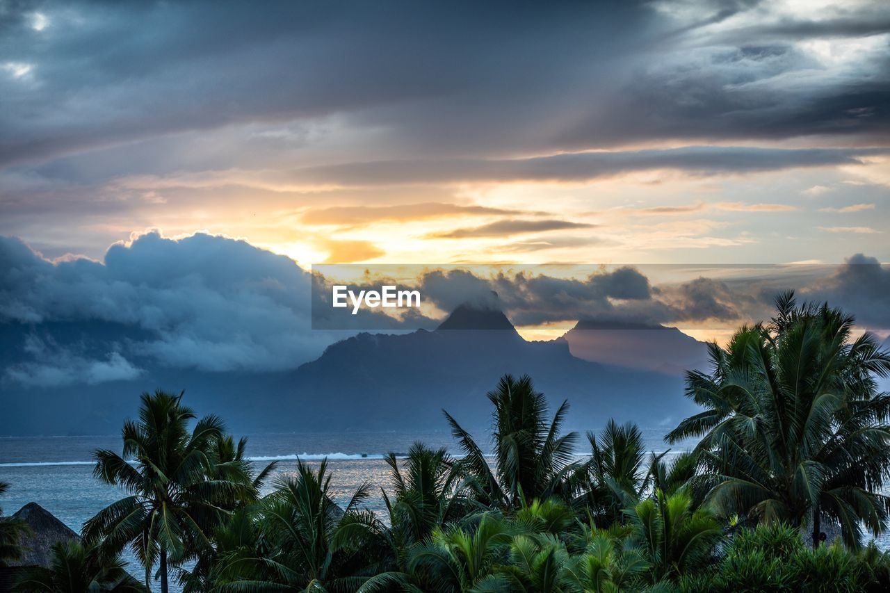 Scenic view of sea against cloudy sky