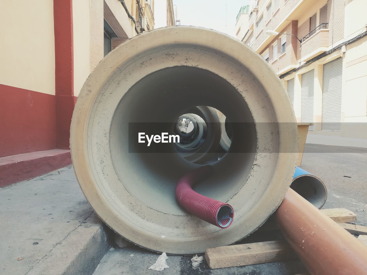 CLOSE-UP OF TIRE AGAINST BUILDING