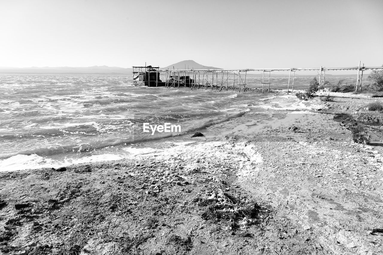 SCENIC VIEW OF BEACH AND SEA AGAINST CLEAR SKY