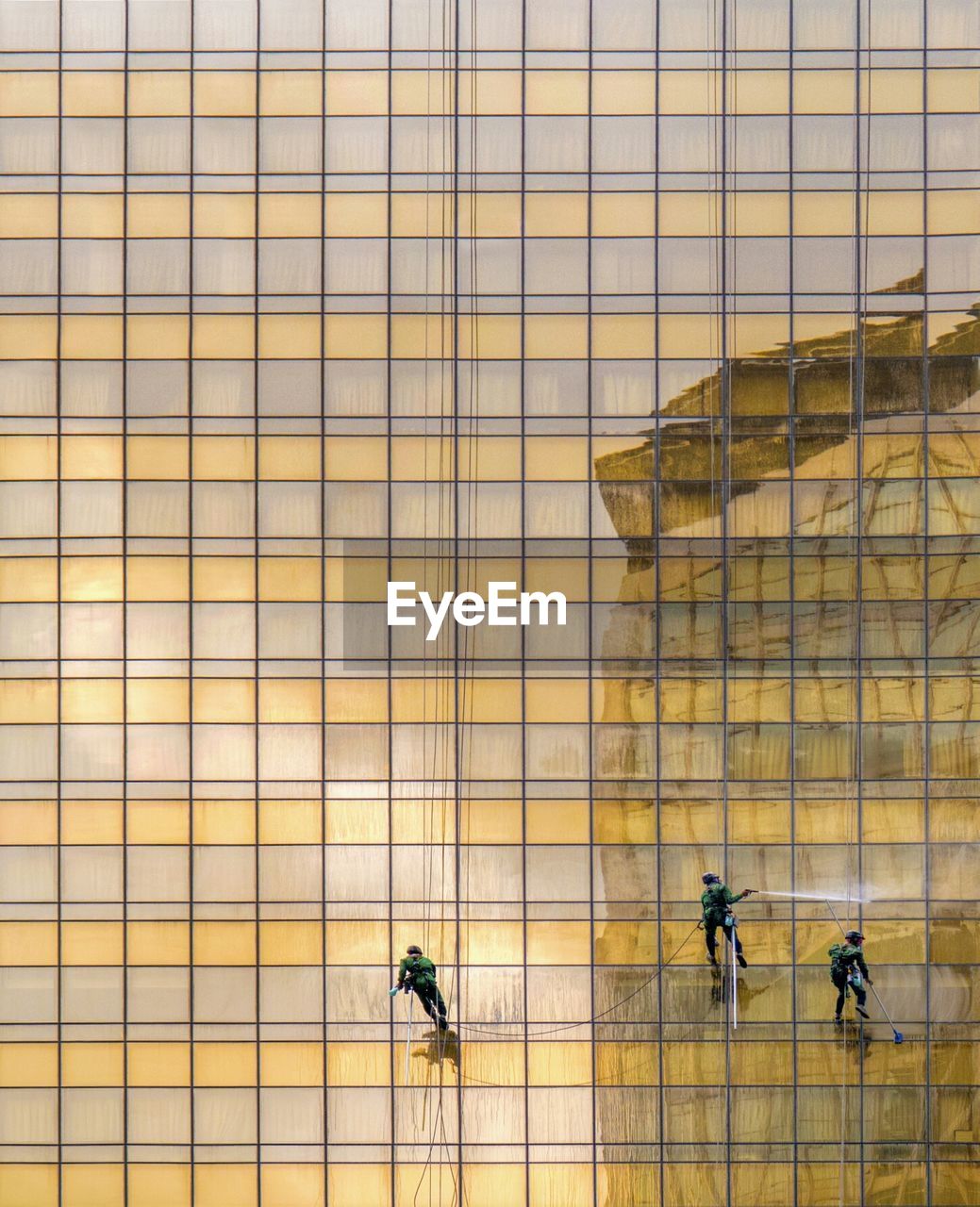 HIGH ANGLE VIEW OF PEOPLE WALKING BY TILED FLOOR