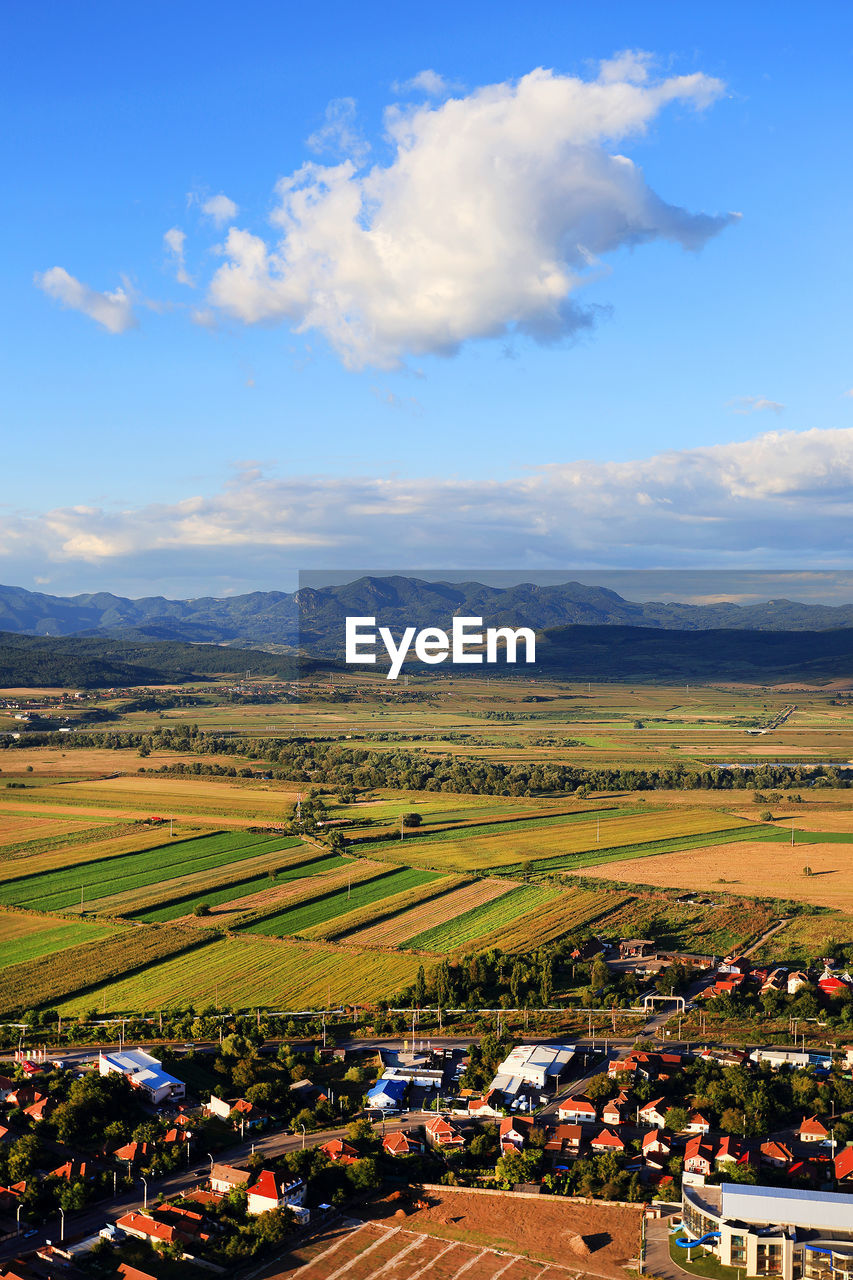 Aerial view of agricultural field against sky