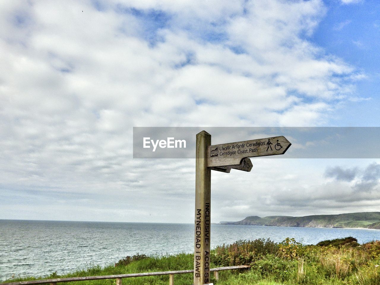 VIEW OF SEA AGAINST CLOUDY SKY