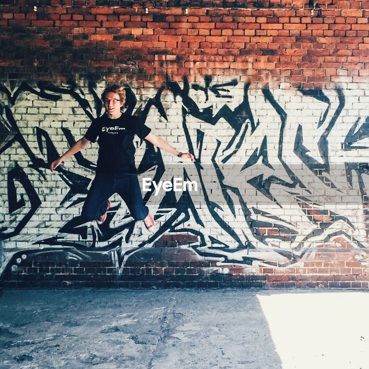 WOMAN STANDING ON WALL