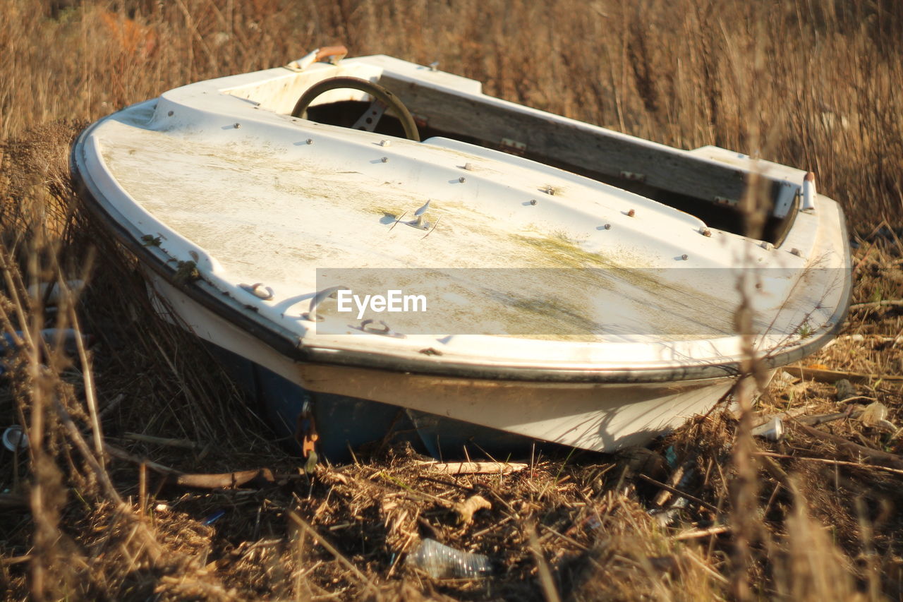 ABANDONED BOAT ON LAND