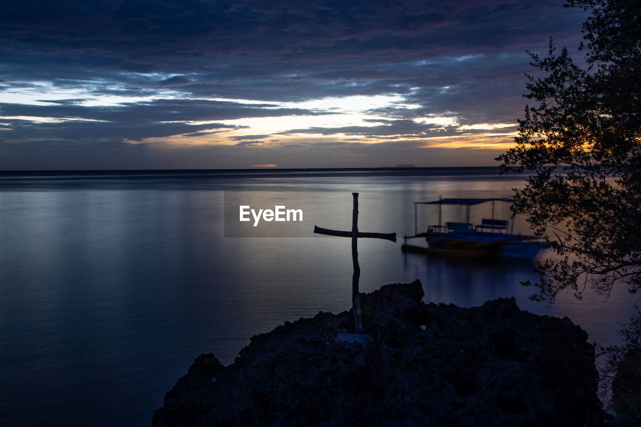 Scenic view of lake against sky during sunset