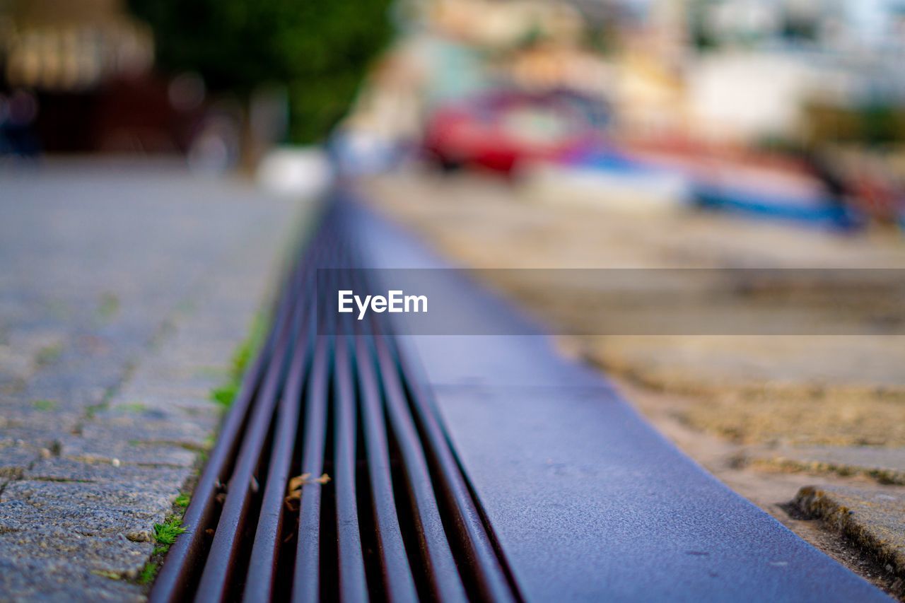 CLOSE-UP OF RAILINGS ON FOOTPATH