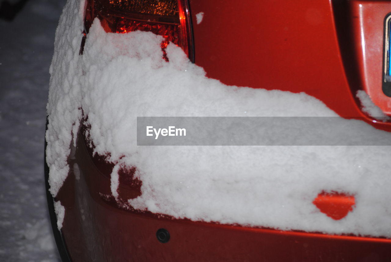 CLOSE-UP OF SNOW ON RED ICE