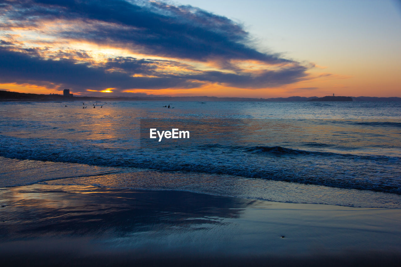 SCENIC VIEW OF SEA DURING SUNSET