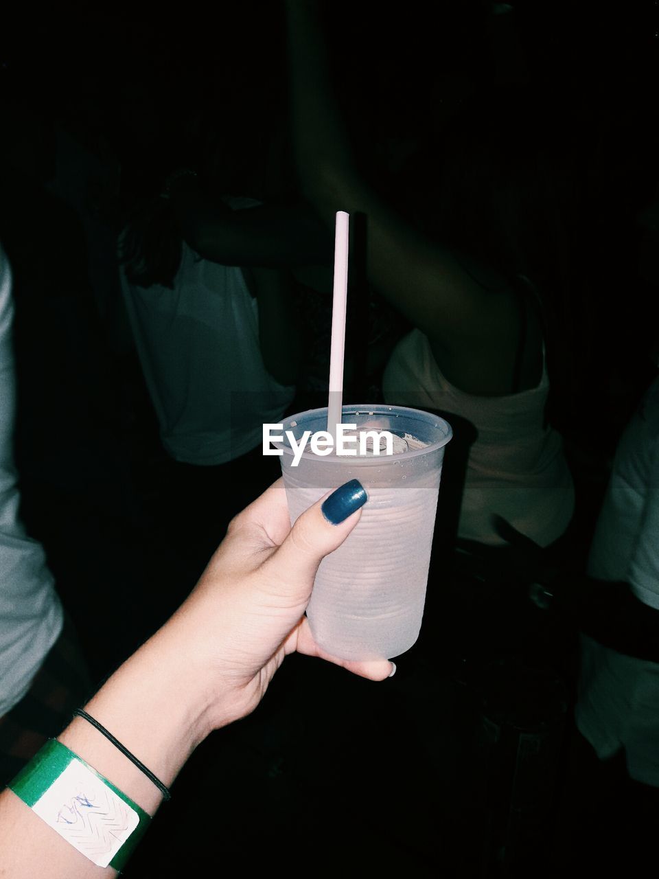 Cropped image of woman holding cold drink