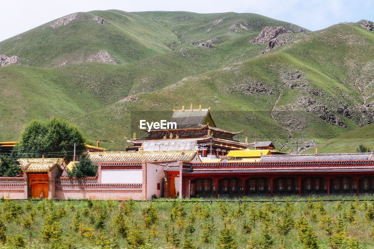 Tibetan building on mountain against sky