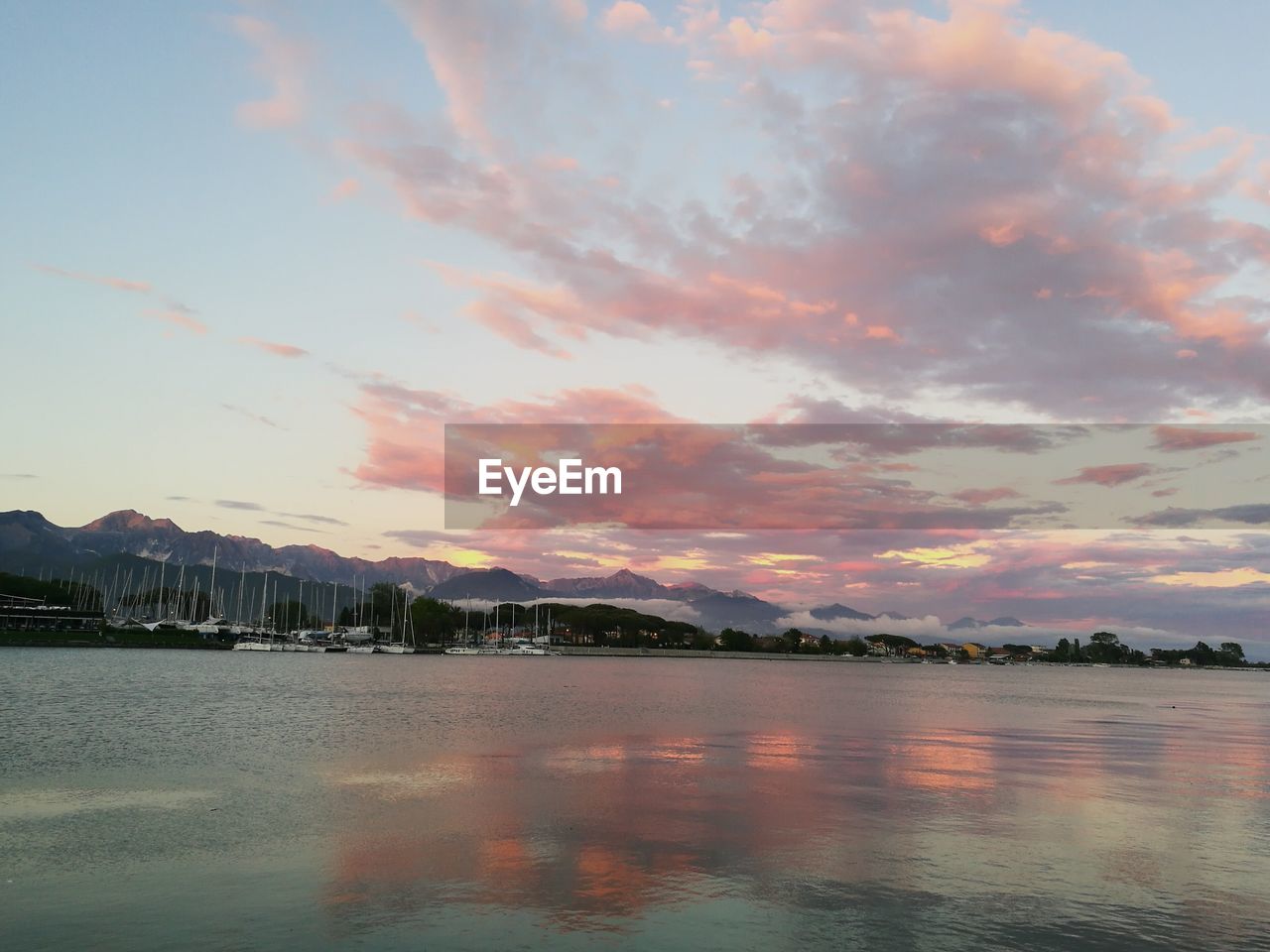 Scenic view of lake against sky during sunset