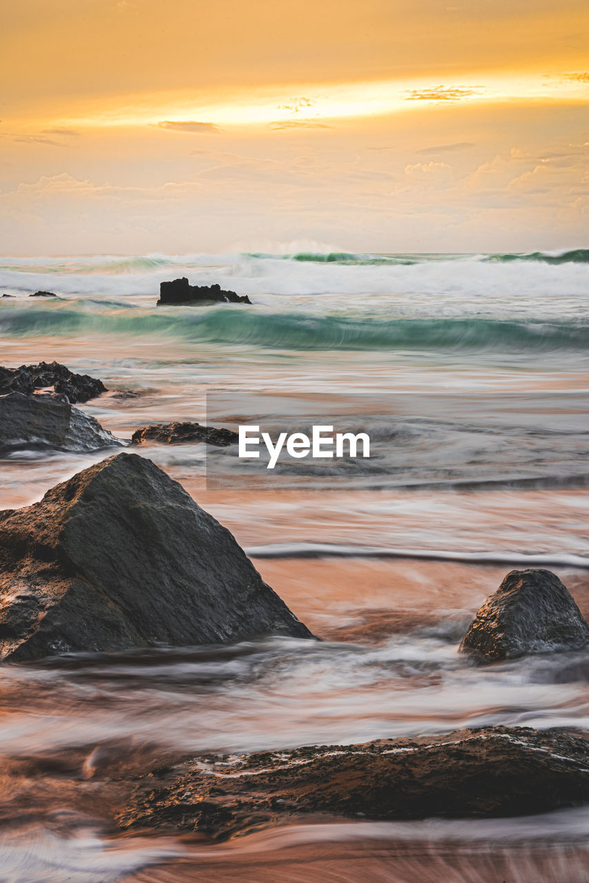 Scenic view of sea against sky during sunset
