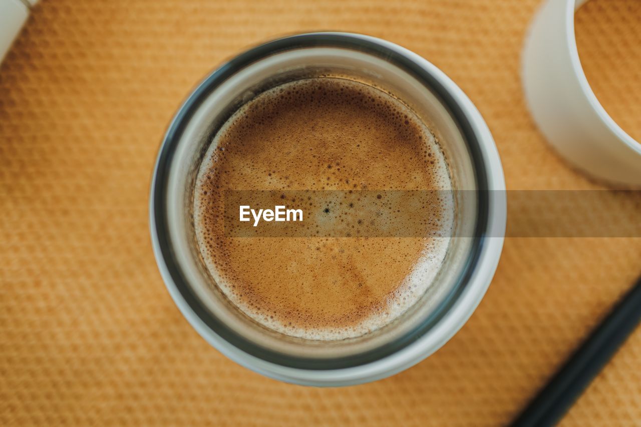 drink, food and drink, refreshment, coffee, mug, cup, table, coffee cup, still life, directly above, indoors, close-up, high angle view, no people, freshness, hot drink, frothy drink, crockery, coffee milk, food, brown, latte