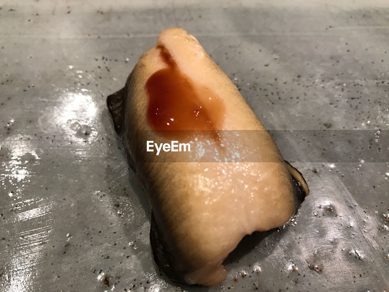 CLOSE-UP OF HUMAN HAND IN BREAD