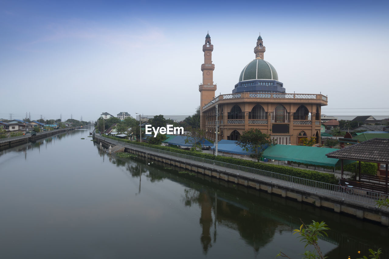 REFLECTION OF MOSQUE IN LAKE