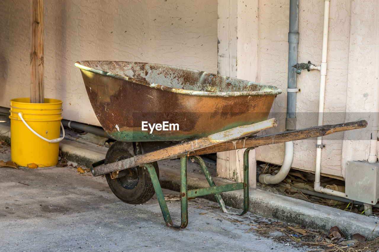 Old wheelbarrow on footpath