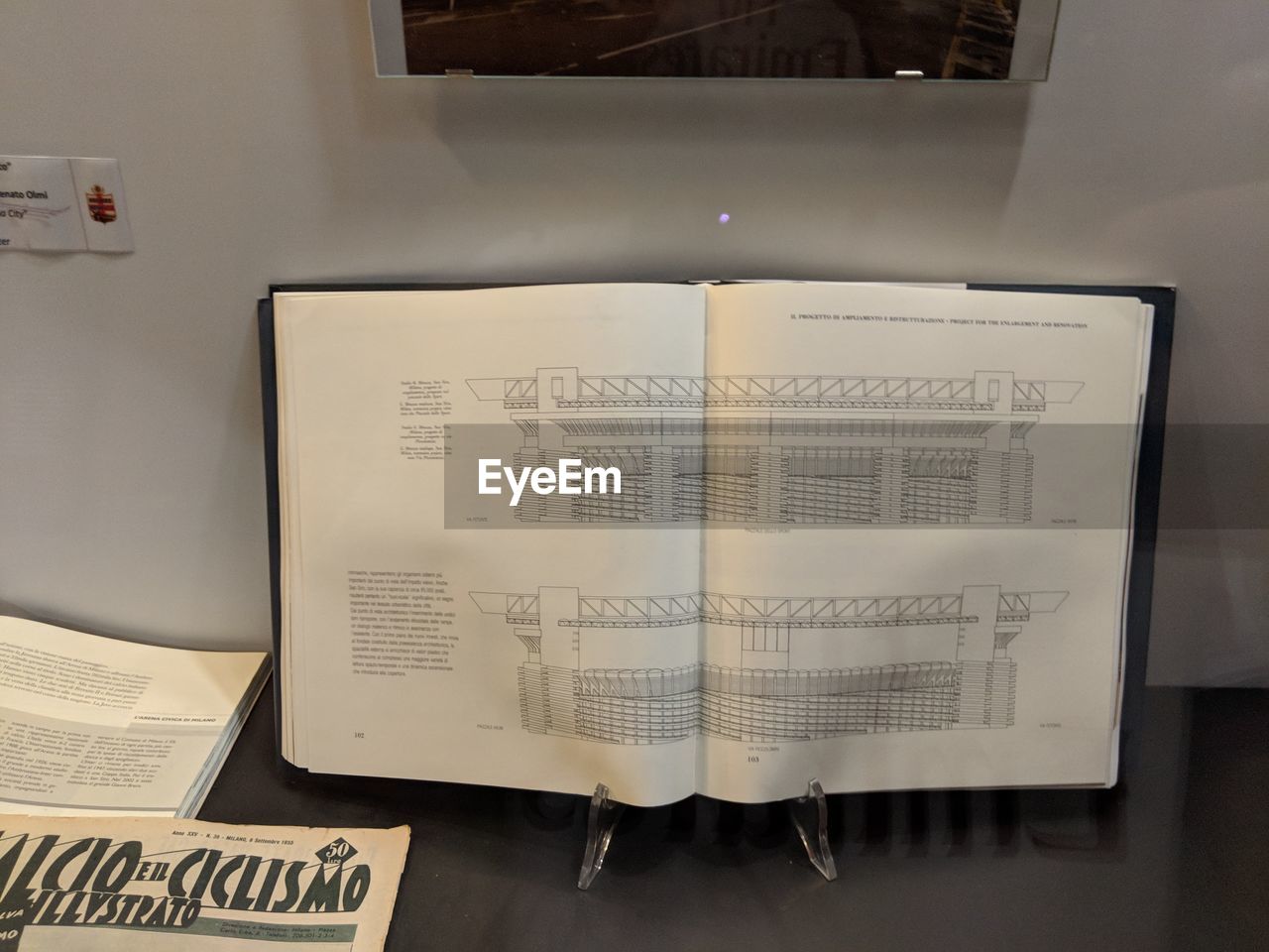 HIGH ANGLE VIEW OF TEXT ON BOOK AT TABLE