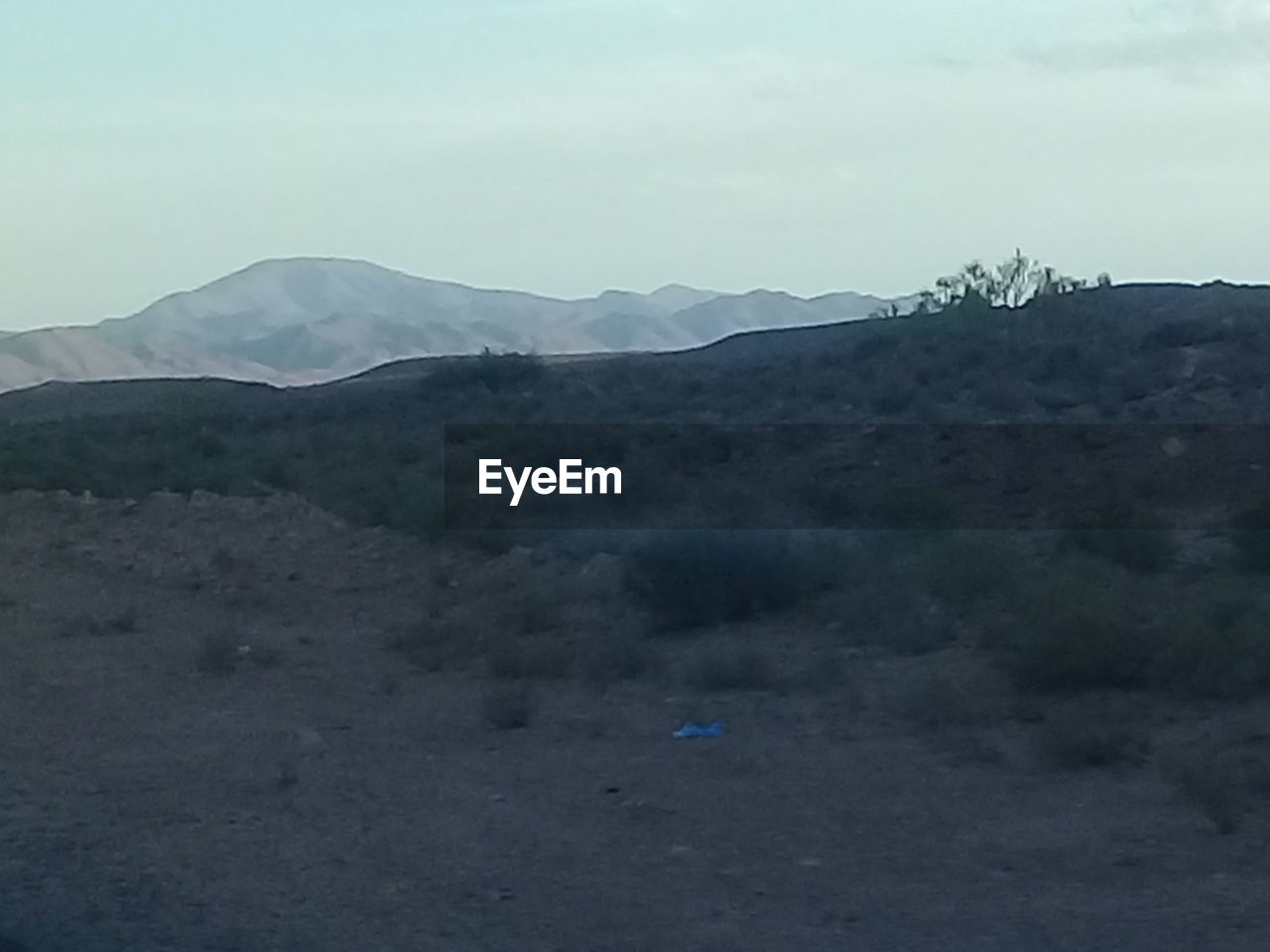 SCENIC VIEW OF LANDSCAPE AND MOUNTAINS AGAINST SKY