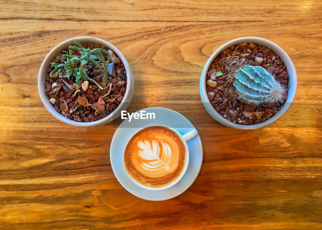 HIGH ANGLE VIEW OF COFFEE CUP WITH TEA