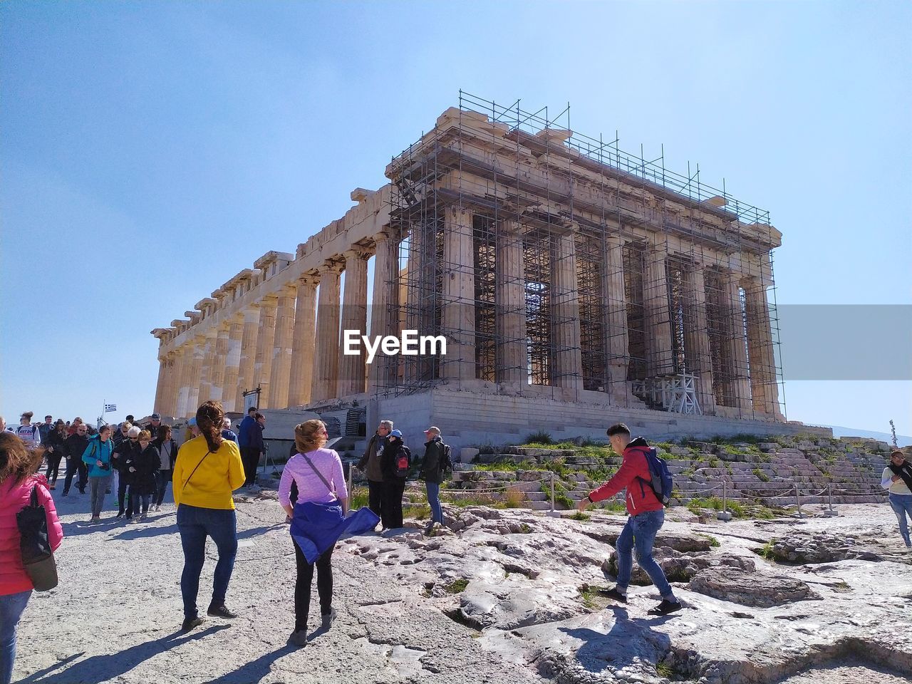 GROUP OF PEOPLE IN FRONT OF BUILDING