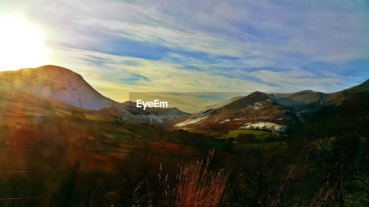 SCENIC VIEW OF MOUNTAIN AGAINST SKY