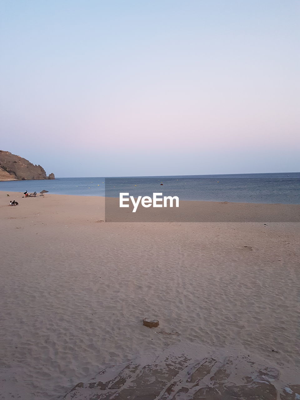 VIEW OF BEACH AGAINST CLEAR SKY