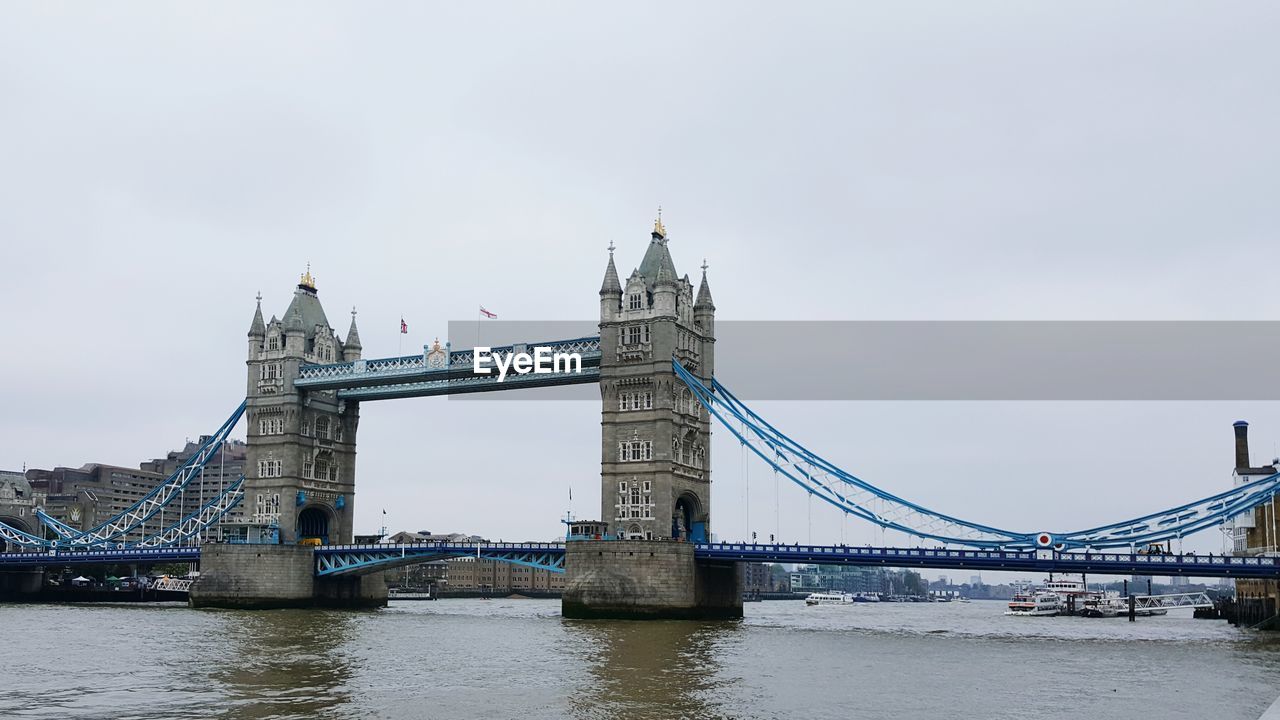 Tower bridge over thames river against clear sky