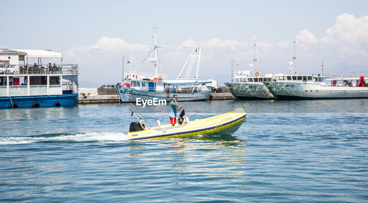 BOATS SAILING ON SEA