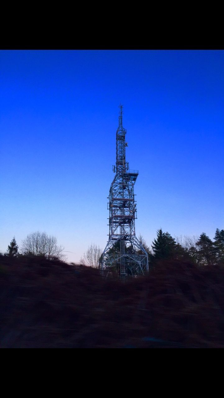 LOW ANGLE VIEW OF SILHOUETTE BUILT STRUCTURES AGAINST CLEAR BLUE SKY