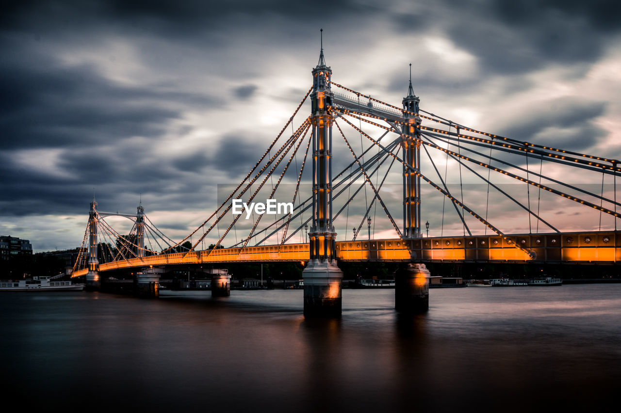 View of illuminated bridge against cloudy sky