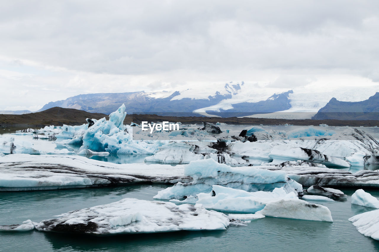 SCENIC VIEW OF GLACIER AGAINST SKY