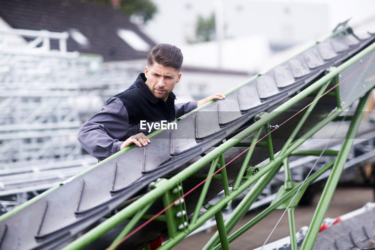 Skilled worker, working in conveyor belt shop