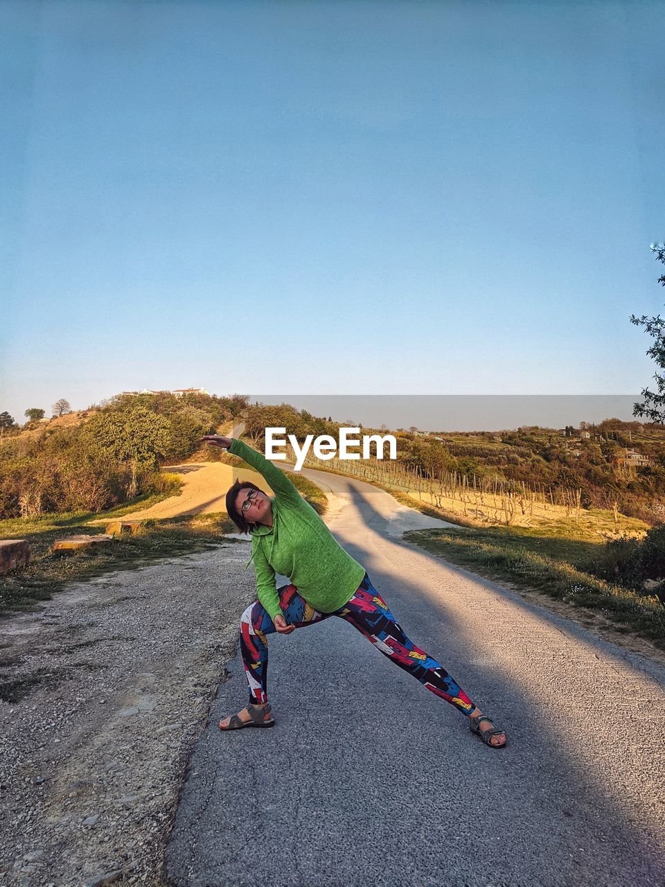 Girl doing yoga outdoors.