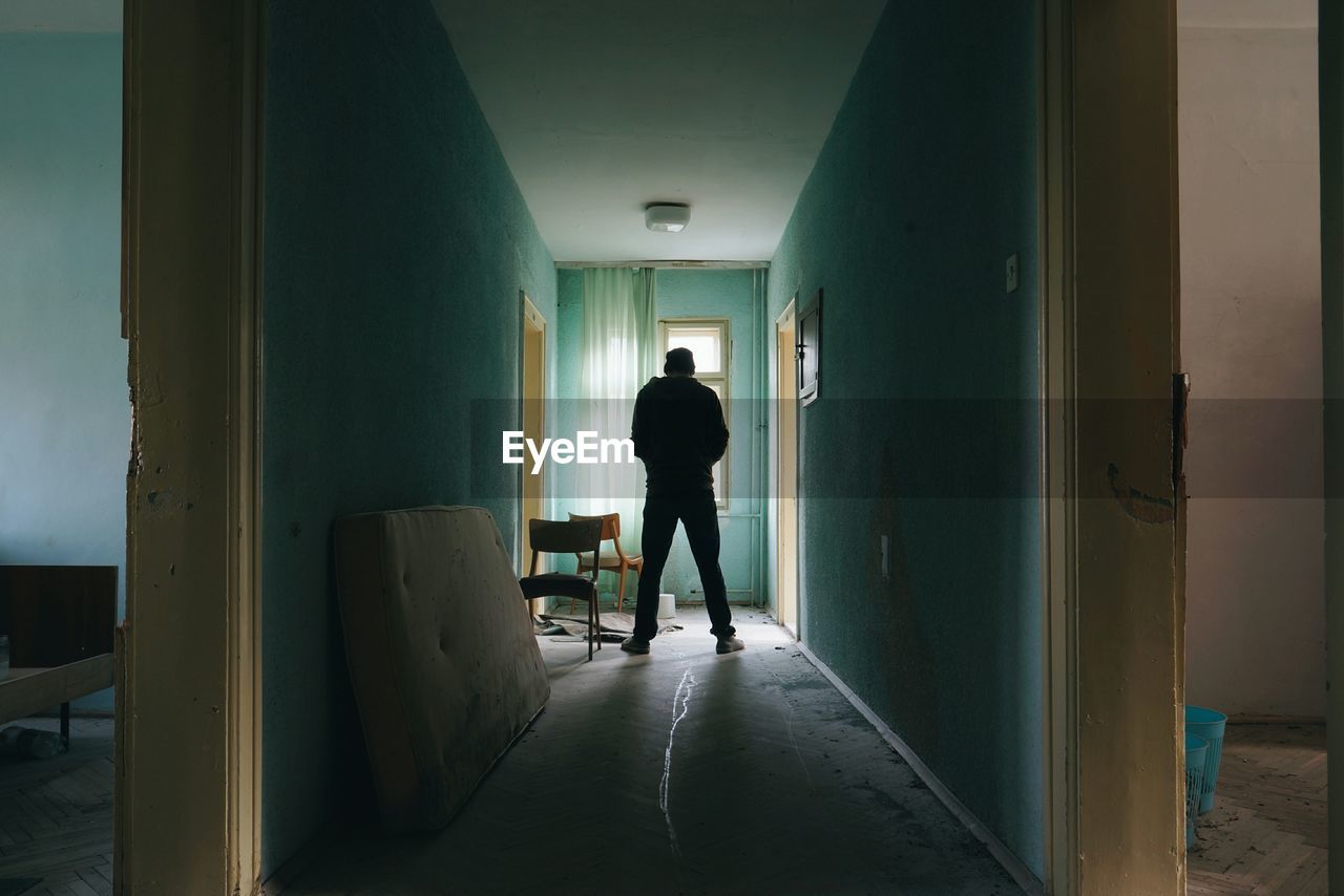 Man standing in corridor