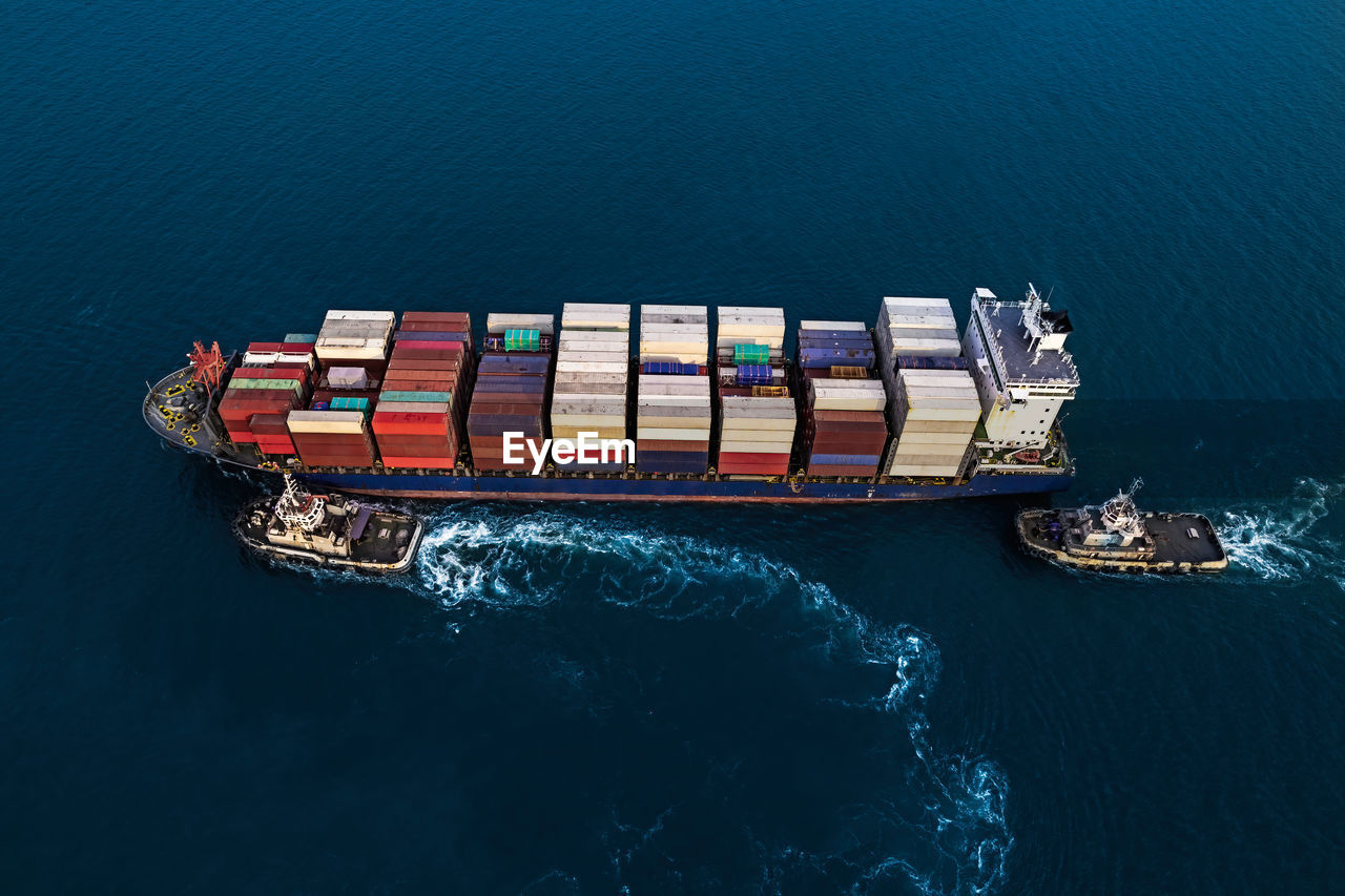 Aerial view container cargo ship in import export business commercial trade logistic.