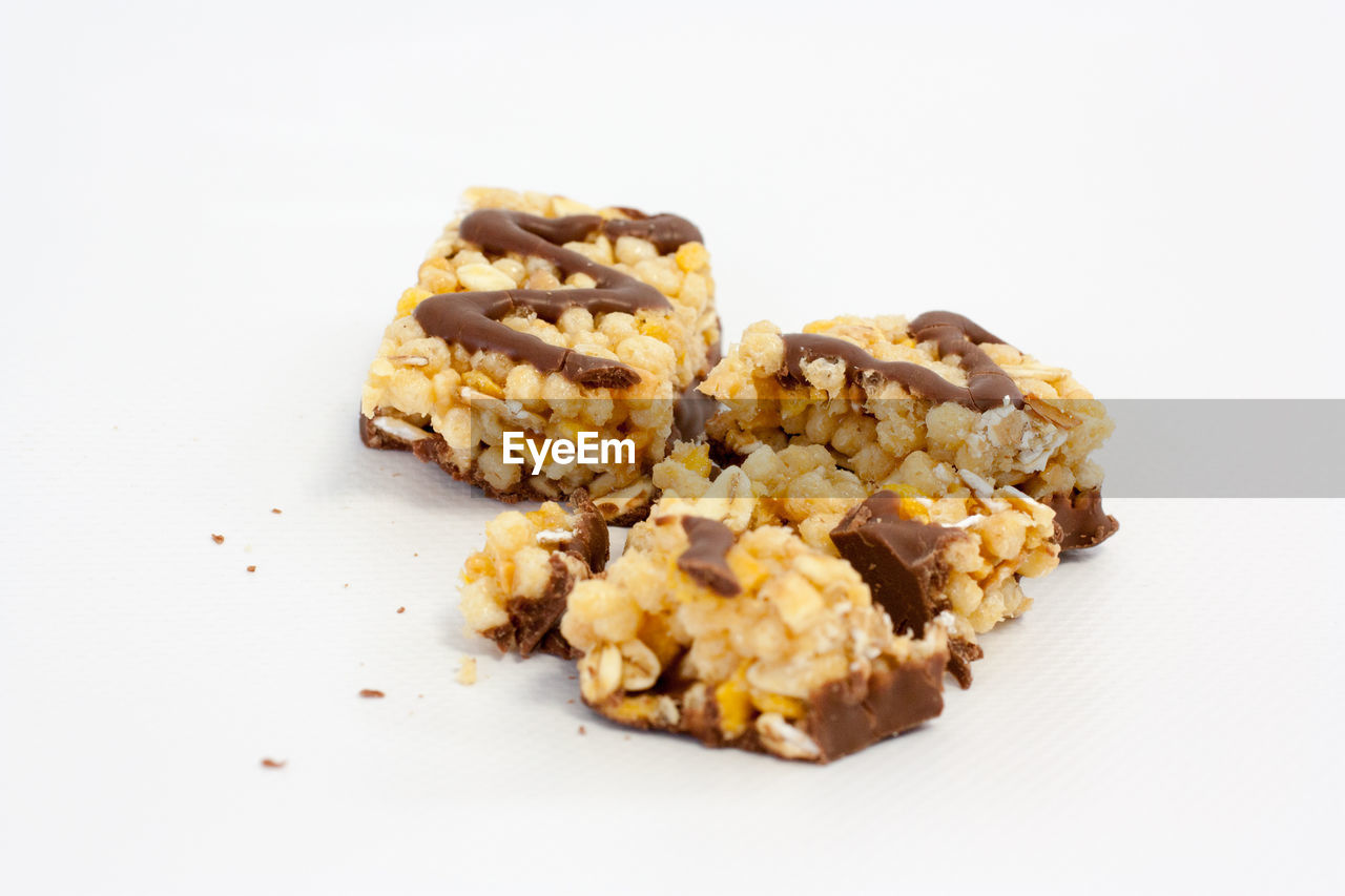 High angle view of granola bar against white background