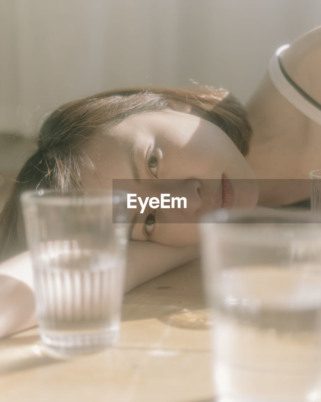 CLOSE-UP PORTRAIT OF A WOMAN WITH DRINK