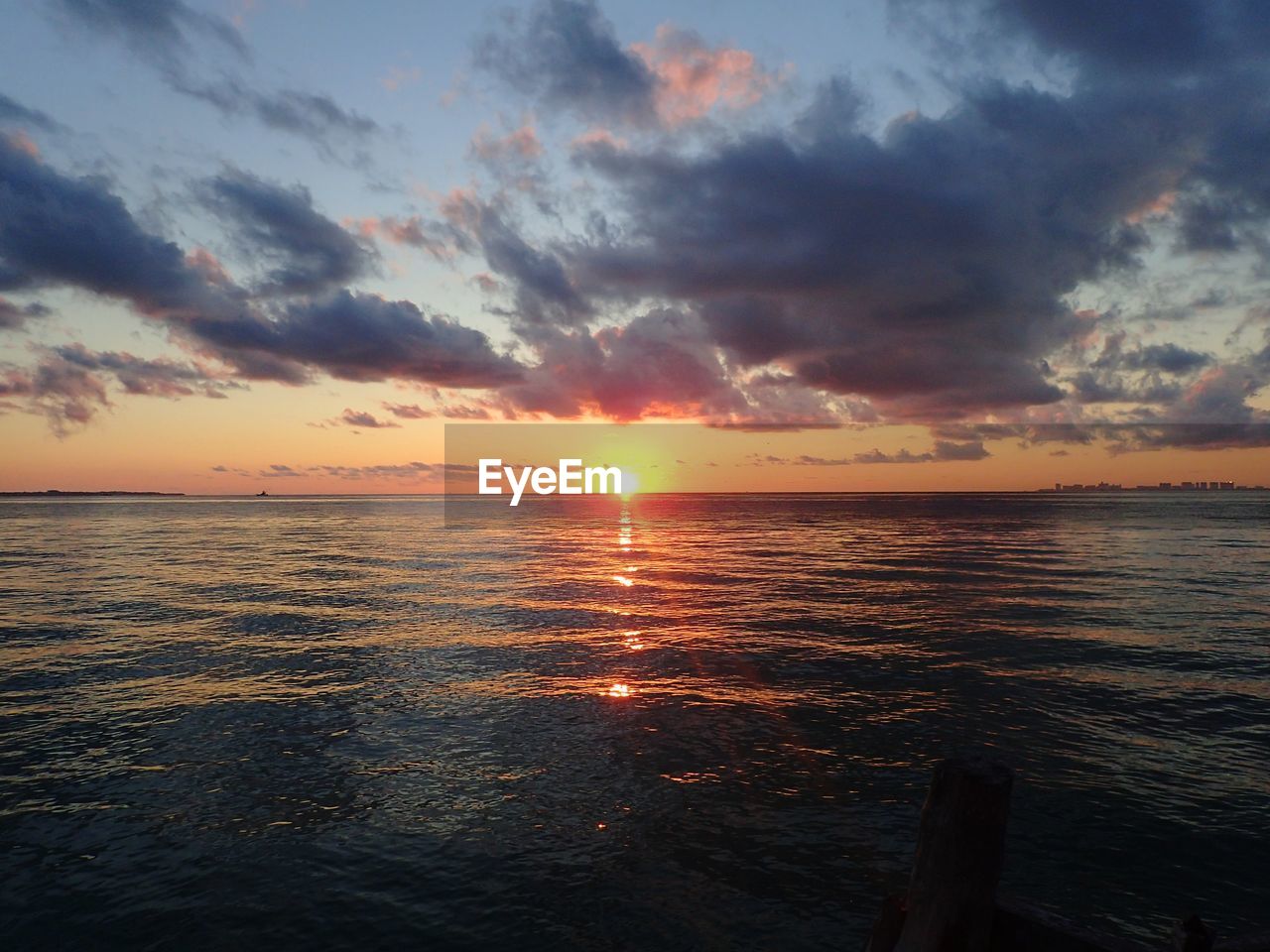 SCENIC VIEW OF SEA AGAINST ORANGE SKY