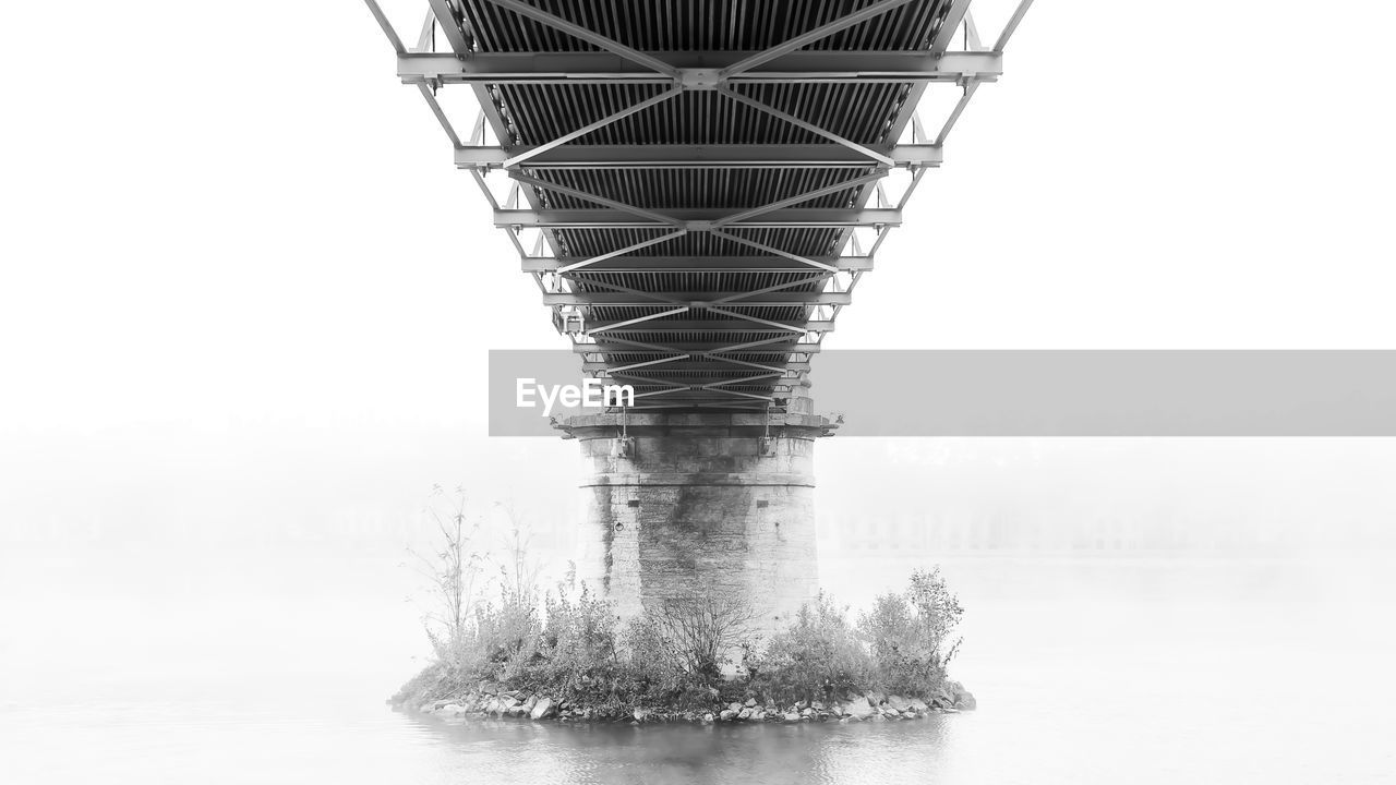 VIEW OF BRIDGE OVER CALM SEA