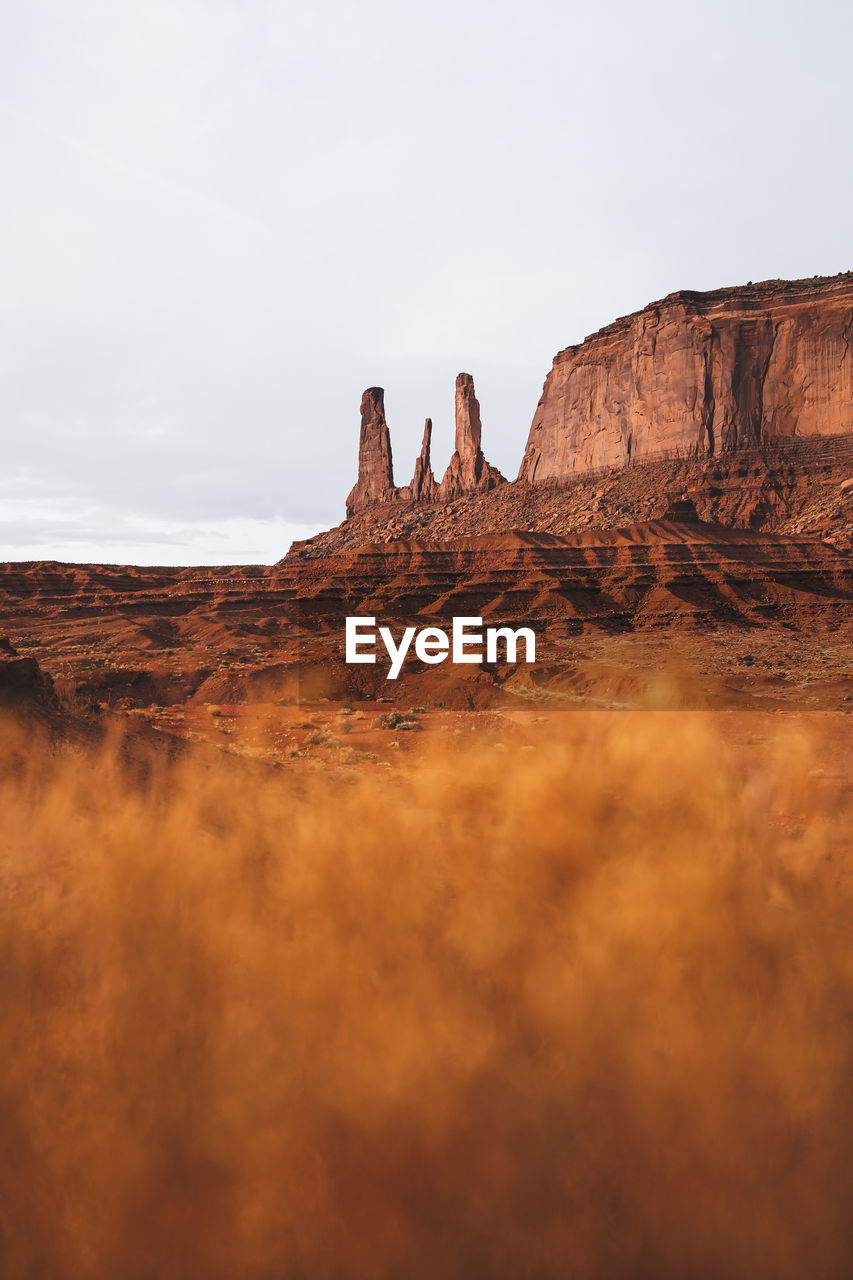 Rock formations on landscape against sky