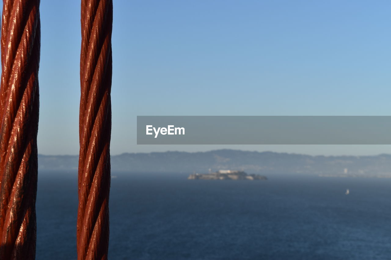 CLOSE-UP OF SEA AGAINST CLEAR BLUE SKY