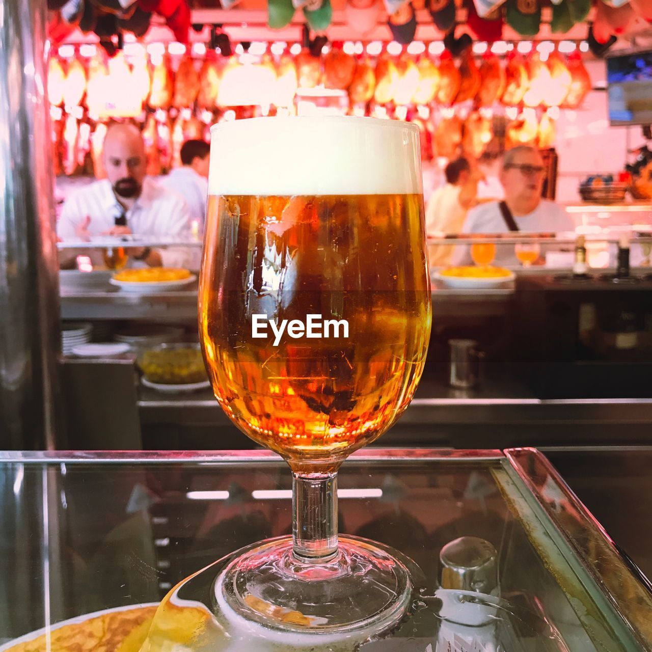 CLOSE-UP OF BEER ON TABLE