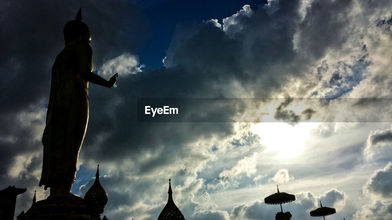 LOW ANGLE VIEW OF TOWER AGAINST CLOUDY SKY