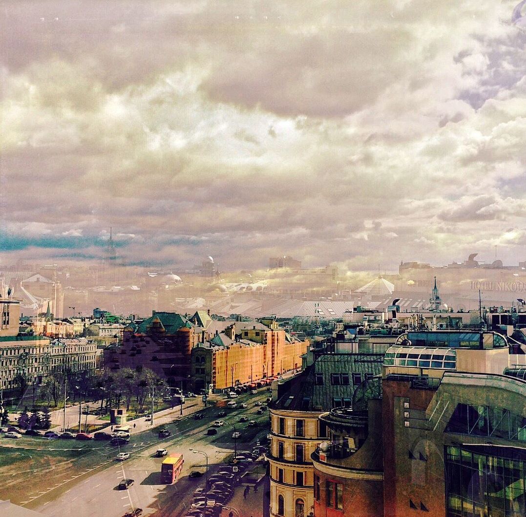 VIEW OF CITY AGAINST CLOUDY SKY