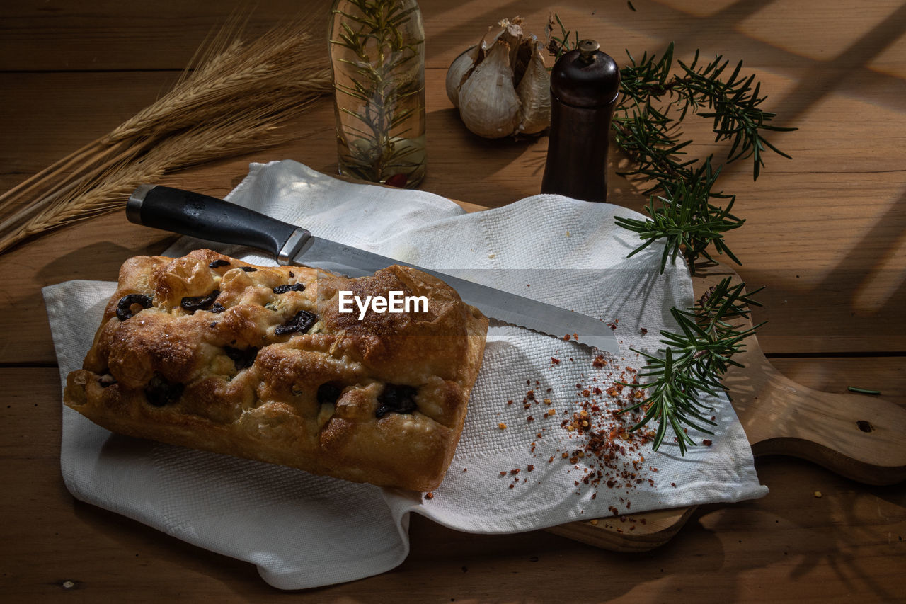 food and drink, food, wood, freshness, meal, table, indoors, no people, baked, high angle view, breakfast, plant, rustic, still life, healthy eating, dish, cutting board, bread, produce, wellbeing, dessert