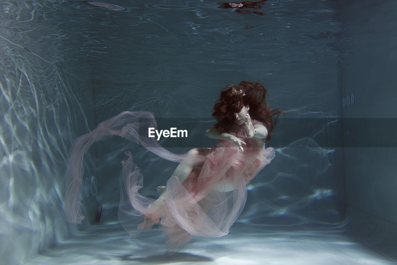 Woman swimming in pool
