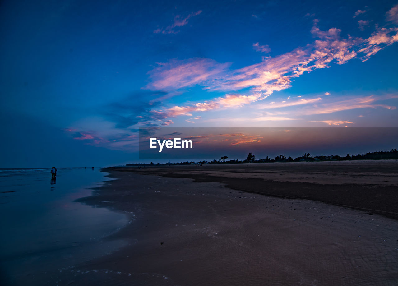 sky, water, sea, land, horizon, cloud, beach, environment, scenics - nature, beauty in nature, nature, landscape, sunset, dawn, ocean, travel, travel destinations, wave, blue, tranquility, sand, reflection, night, evening, seascape, coast, outdoors, dramatic sky, tourism, tranquil scene, horizon over water, coastline, holiday, no people, trip, vacation, shore, tide, urban skyline, wind wave, summer, non-urban scene, low tide