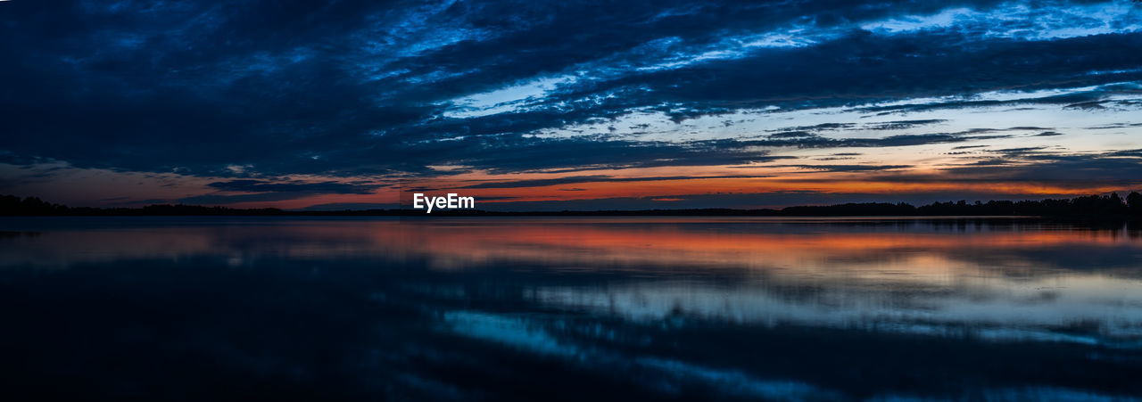 SCENIC VIEW OF LAKE AGAINST ROMANTIC SKY